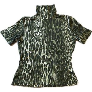 St .John Sport short sleeve with mock neck and black embellished studs.